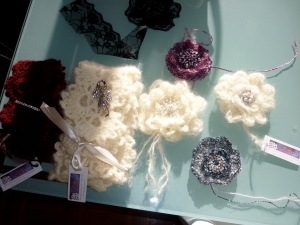 Soft and Lush selection of brooches and Victorian mohair scarves with antique-styled brooch.