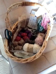 Soft and Lush basket full of wool, crochet hooks, scissors and crochet knick-knackery.