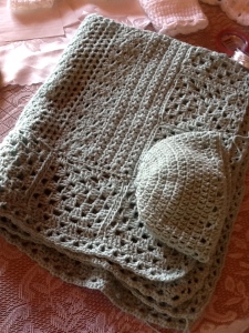 Soft and Lush baby blanket made with crochet Granny Squares as border.